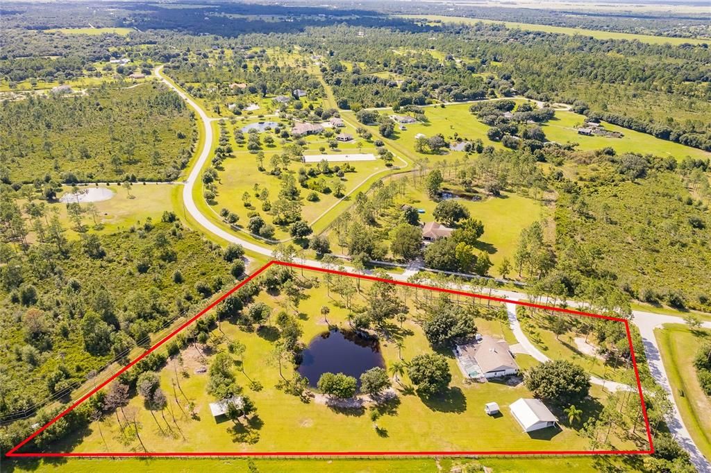 PRAIRIE CREEK PARK WITH ALL  5 ACRE HOME SITES. PAVED ROADS THROUGH OUT AND A SHORE DRIVE TO GROCERY STORES GAS STATIONS & PUNTA GORDA !