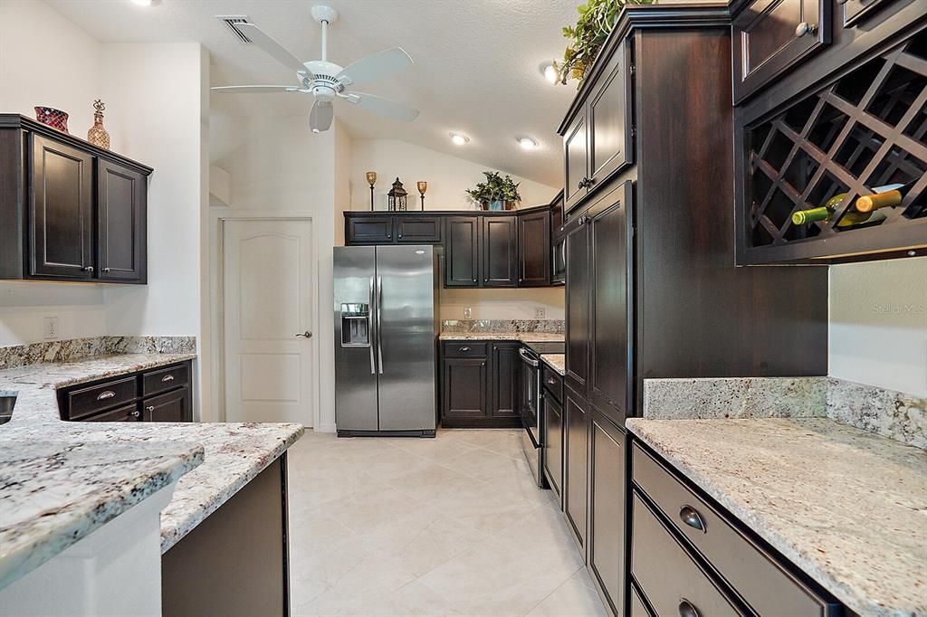 Kitchen with Granite countertops and tile flooring
