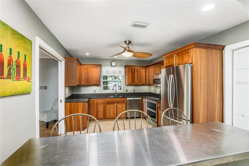 Eat in breakfast bar and kitchen, stainless appliances, double ovens, Bosch dishwasher, wood shaker style cabinets, granite counter tops, walk in pantry