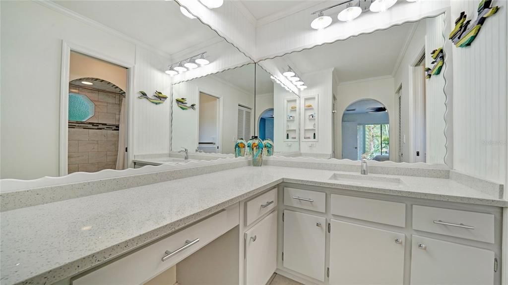 Sparkle quartz gives this master bathroom the elegance and ambiance with the updated lights and accessories
