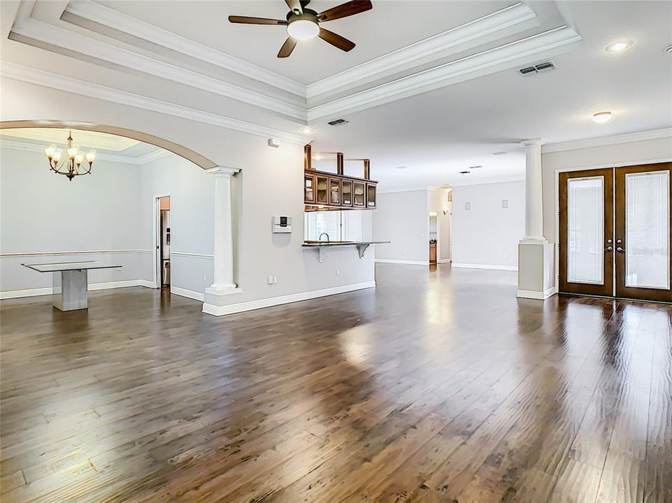 What a lovely view of formal dining room and from the corner of living room to front door, past the kitchen, and into the family room.  Love to entertain! There's definitely room here!