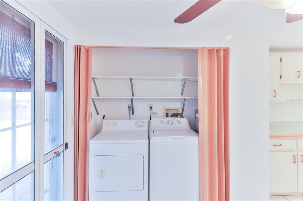 Laundry area in closet in kitchen