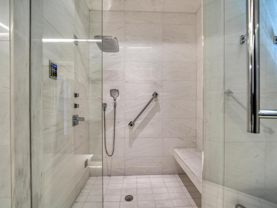 Walk in master shower with steam capability, Bianco Venato marble.