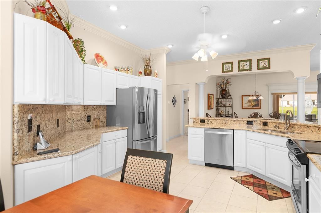 Notice how they've carried the Cambria Quartz Up The Walls As Backsplash. Also Upgraded Stainless Steel Appliances. Gleaming Cabinets. Very Well Done.