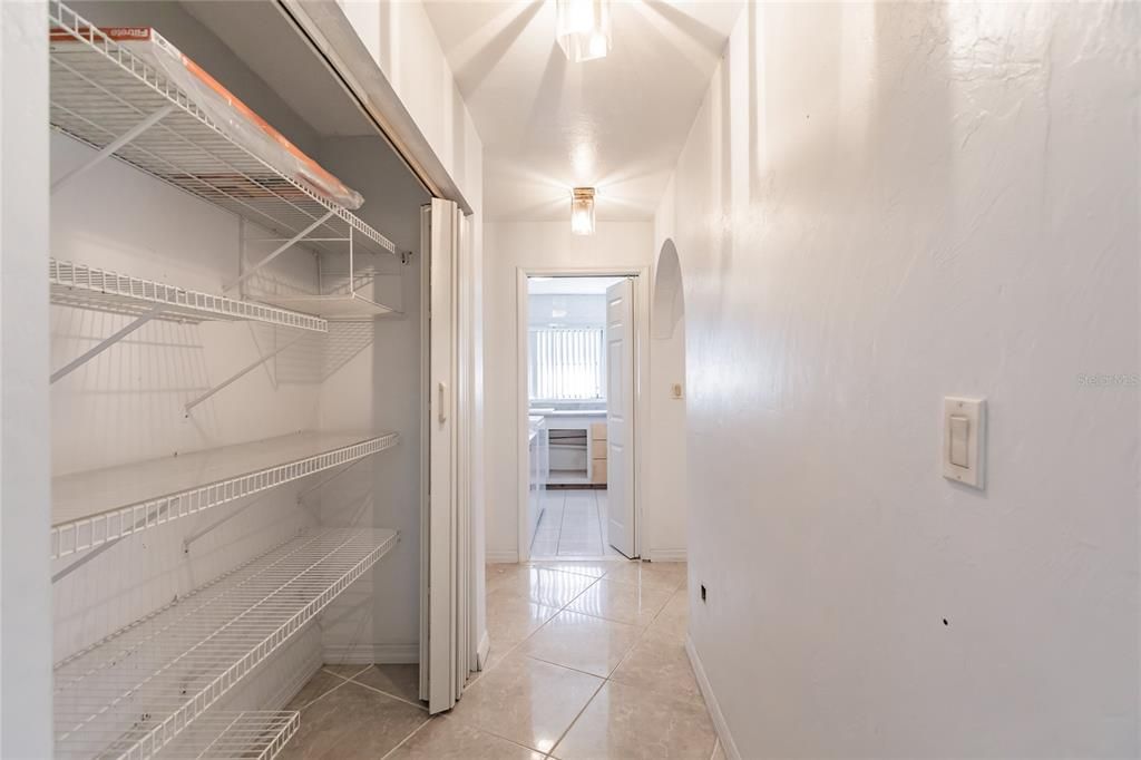 PANTRY IN HALLWAY LEADING TO LAUNDRY ROOM