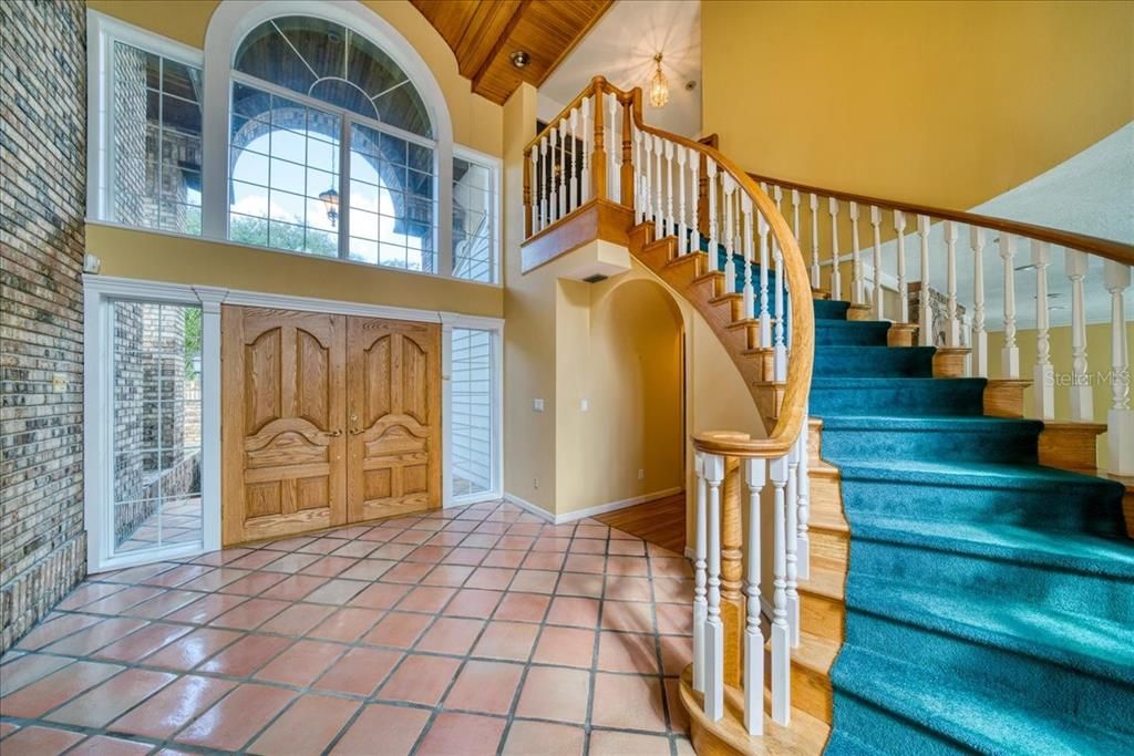 Foyer with sweeping staircase