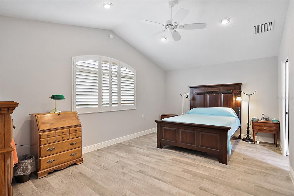 Bedroom 2 Master bedroom with vaulted ceiling and plantation shutters