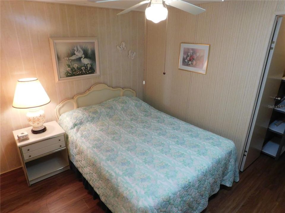 Bedroom #2 has laminate flooring, ceiling fan and walk-in closet.