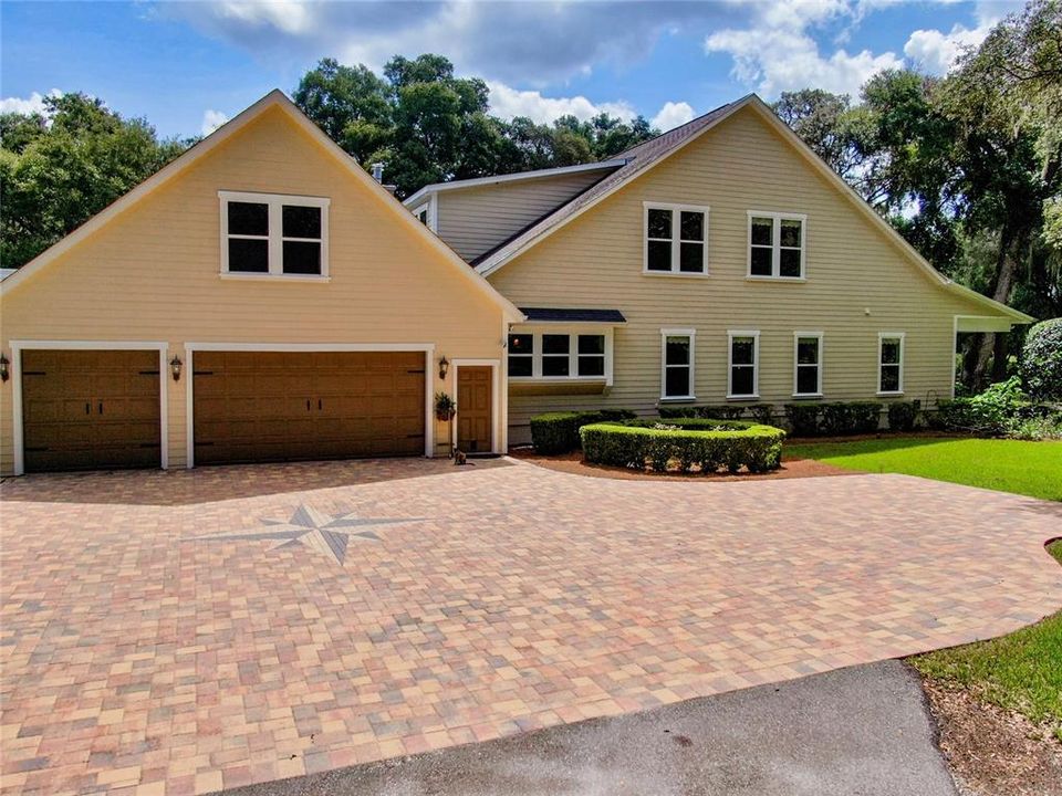 Elegant paver driveway with starburst medallion - plenty of parking & a true 3 car garage