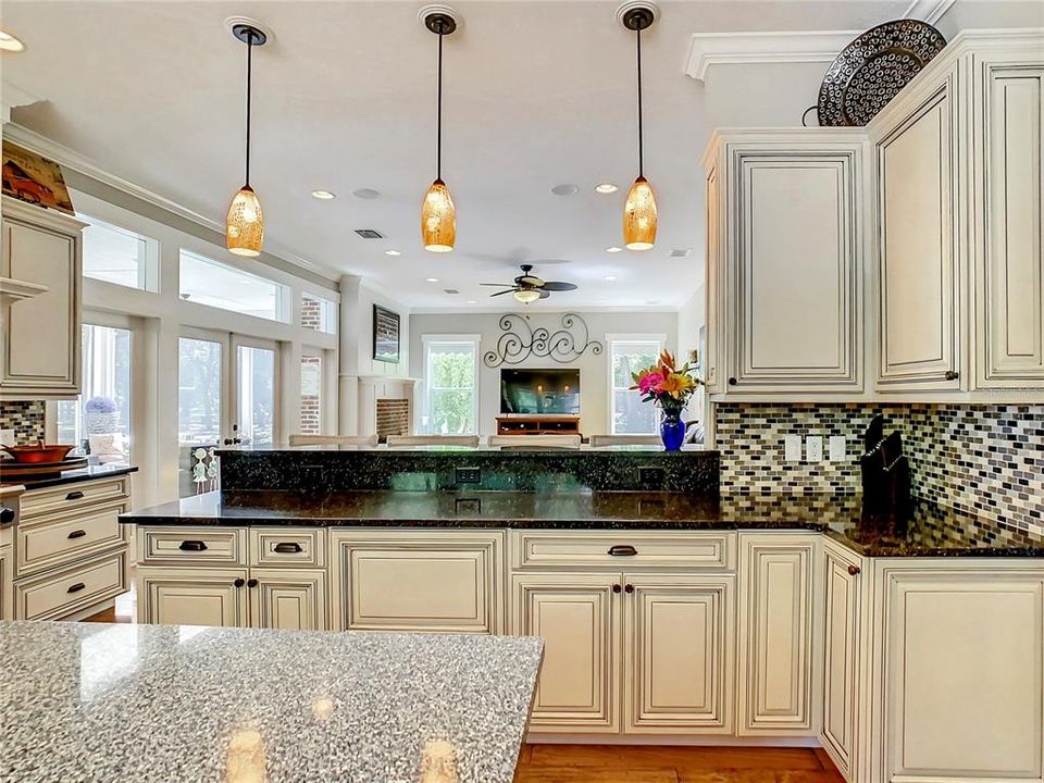 Beautiful Pendant Lights frame this lovely kitchen in beautiful light