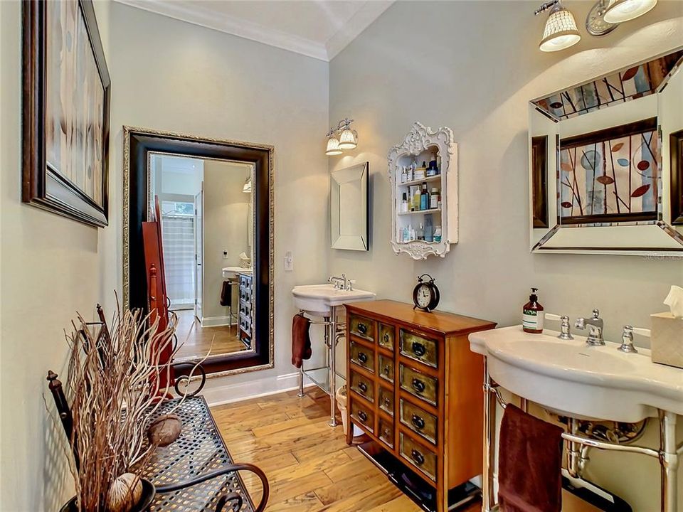 Beautiful dual pedestal sinks and beveled mirrors in the master bath and a large linen closet for great storage