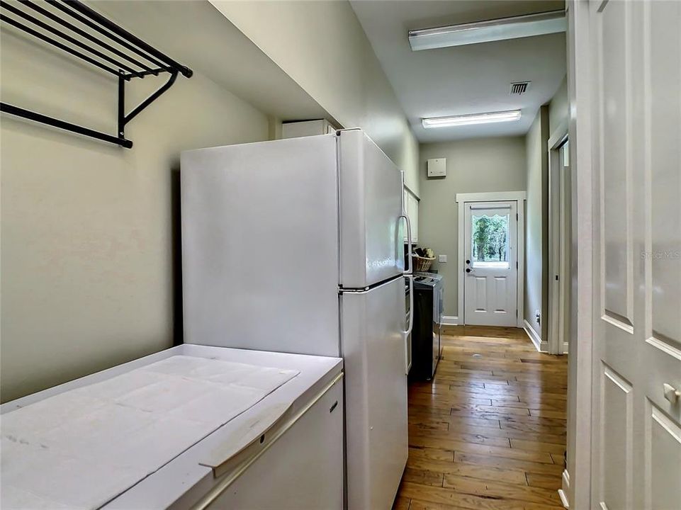 Mud Room has a door that leads outside - perfect to head out to the pool and / or outdoor shower