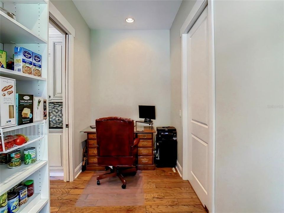 Desk area in large pantry - could easily be a wine storage area, additional shelving, 2nd fridge, etc.