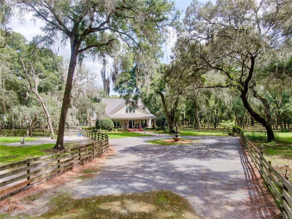 Long, curving driveways set the stage for a serene setting