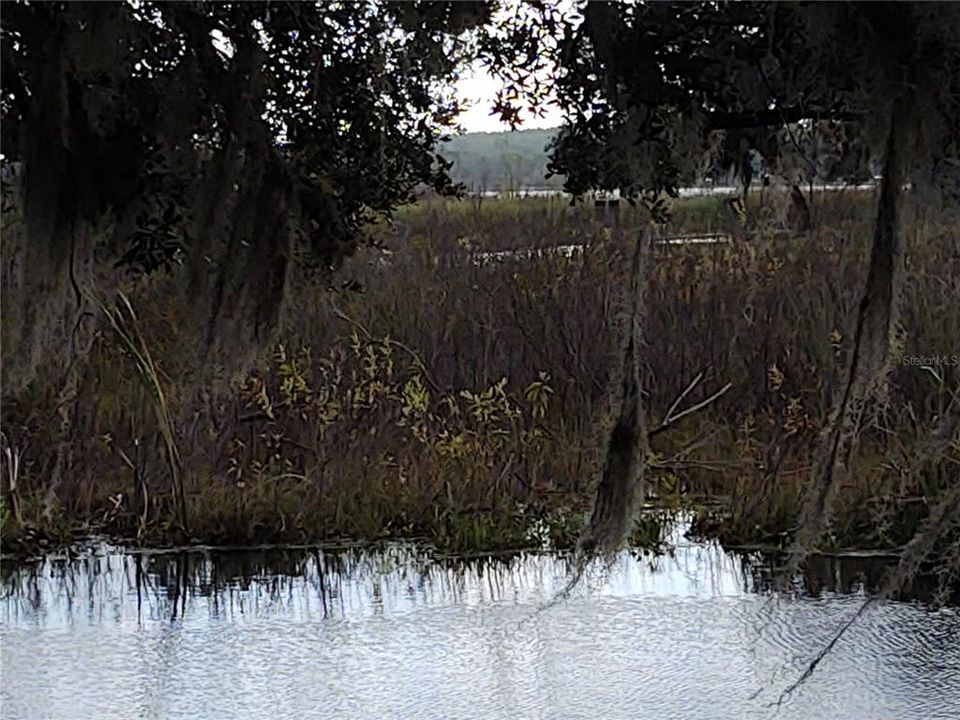 Big Lake Kerr in the background.  Canal on south side of home.