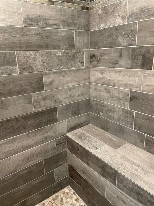 Custom tiled walk-in shower in master suite