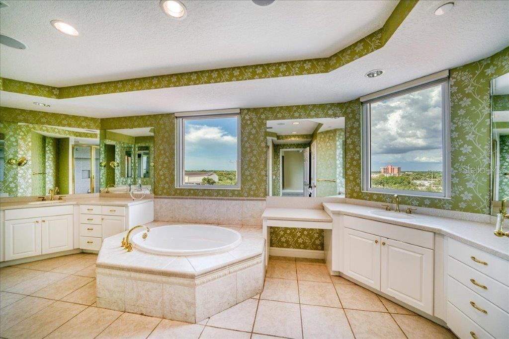 Large Master Bath with dual vanities and soaker tub.