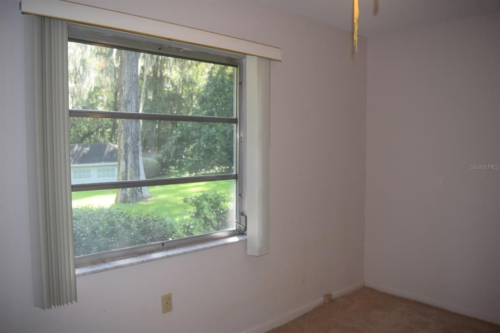 Bedroom 3 overlooking back yard and canal