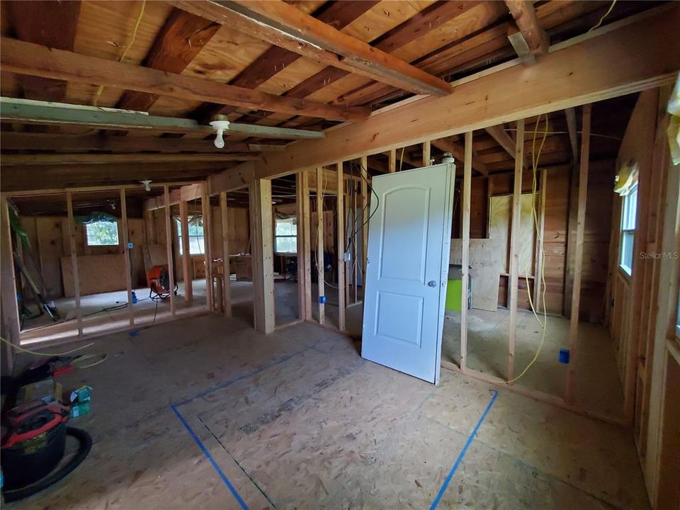 view from master bedroom looking toward second bedroom on right and living room on left.