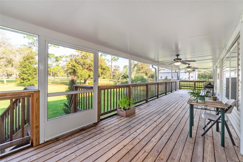 10x60 screened porch, 4 fans with lights, pretty wood decking