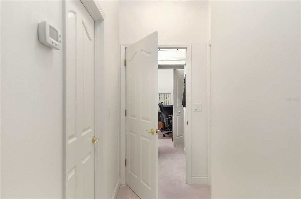 His and Her walk-in closets with secret walk through to Office