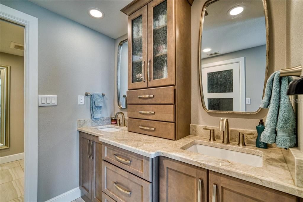 The custom double vanities of the master dressing area have incorporated electrical outlets in the drawers and so much storage. Behind are the walk in closet and the shoe closet,   yes,  shoe closet!!
