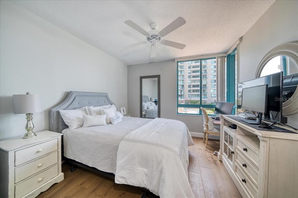 The guest bedroom is spacious and bright and has corner windows with a view of the gulf waters and the pool decks below.  They may never want to leave!!!