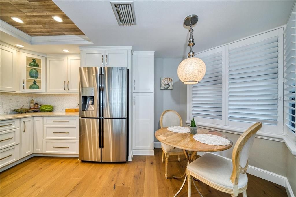 The kitchen is not only beautiful but well thought out. There is a breakfast bar and an eat in kitchen as well! Shutters give you a view out to the east.