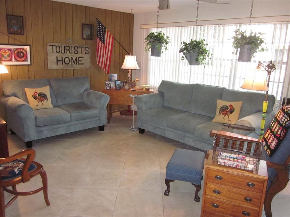 SPACIOUS LIVING ROOM WITH CERAMIC TILE FLOOR