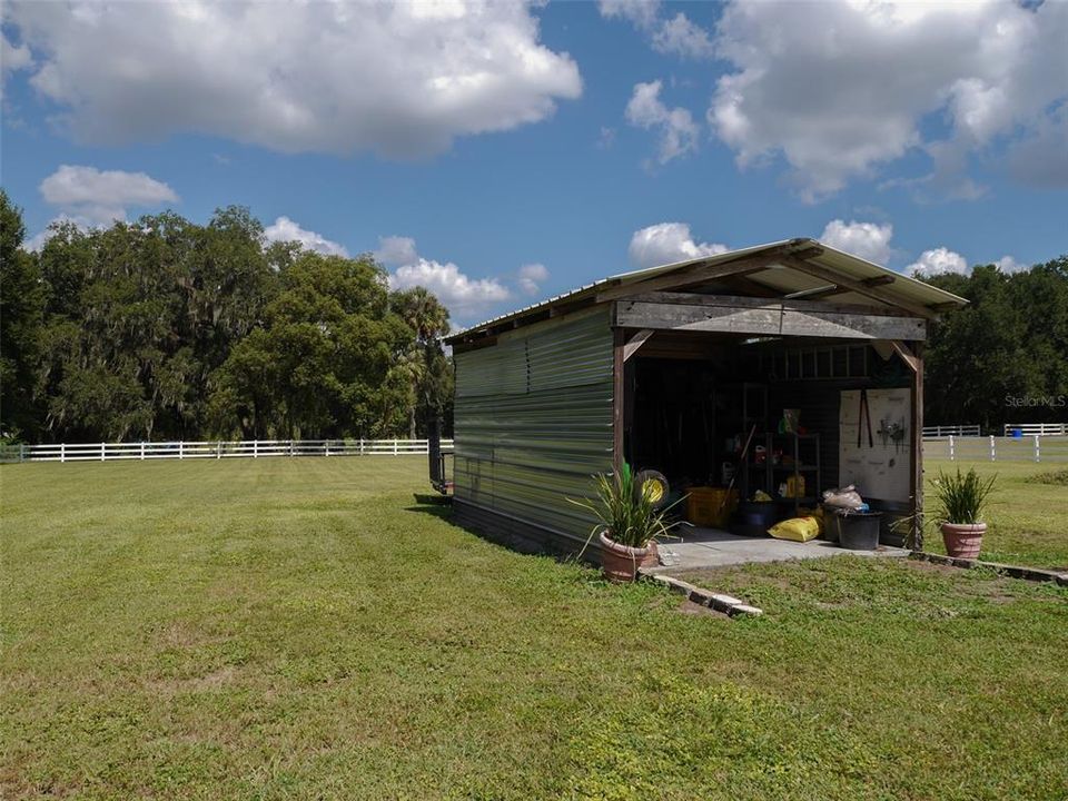 Shed for outdoor equipment and ride on mower