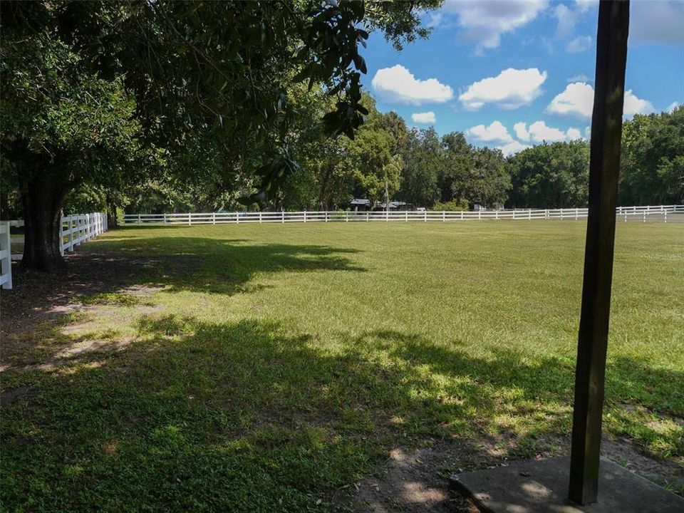 Entire property surrounded by vinyl 2 rail fence