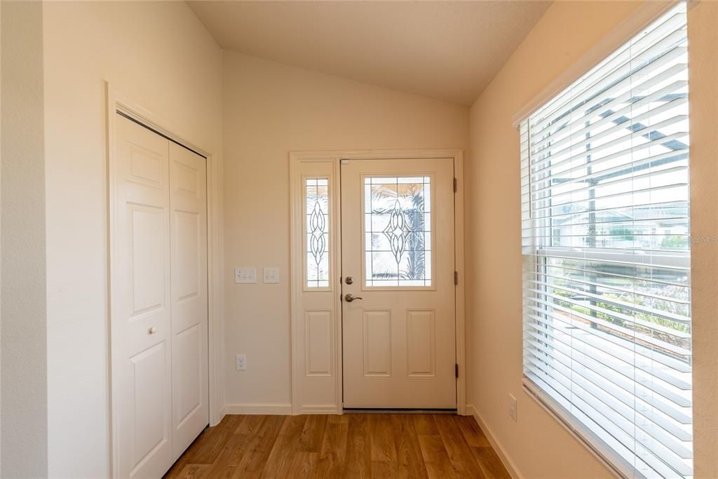 Entrance with large coat closet to left