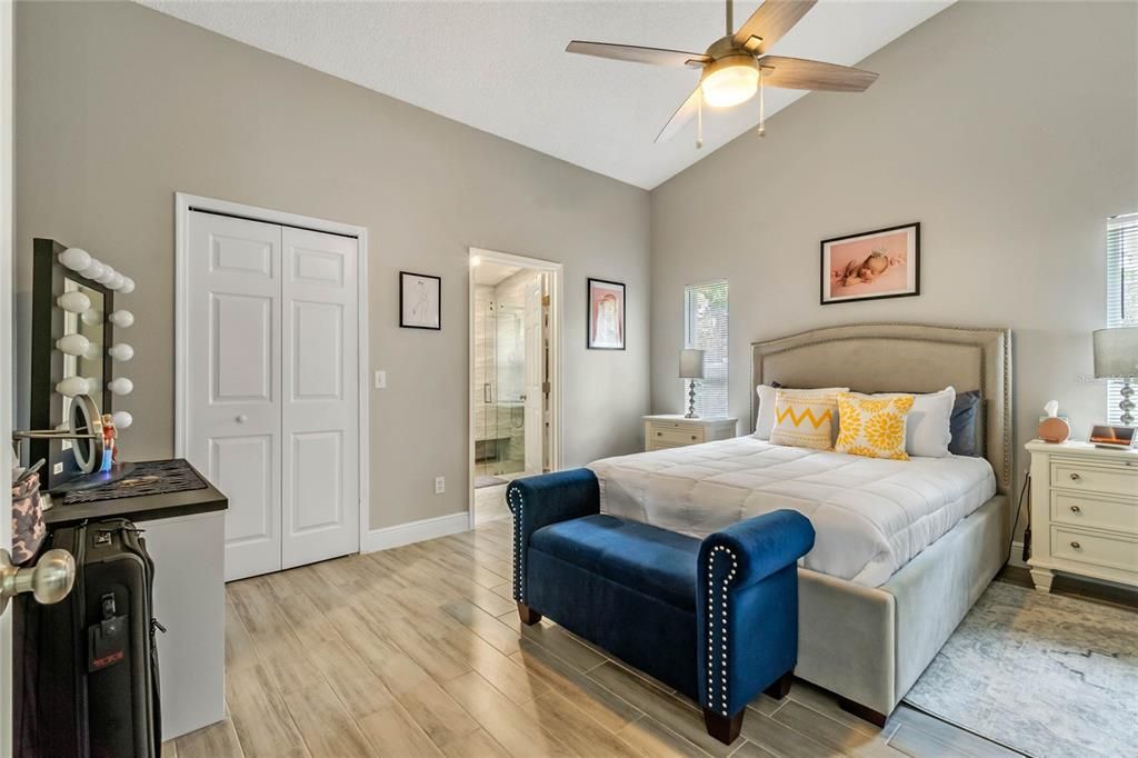 The PRIMARY SUITE provides a spacious closet, VAULTED CEILINGS and an UPDATED EN-SUITE!