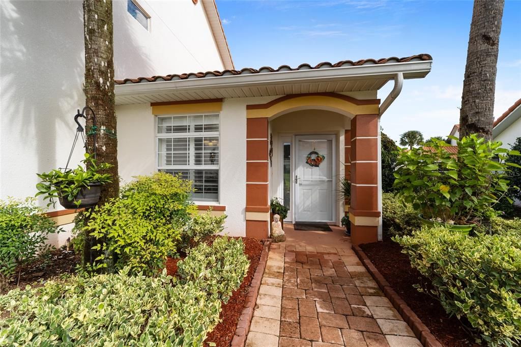 Front of Condo W/Lush Landscaping