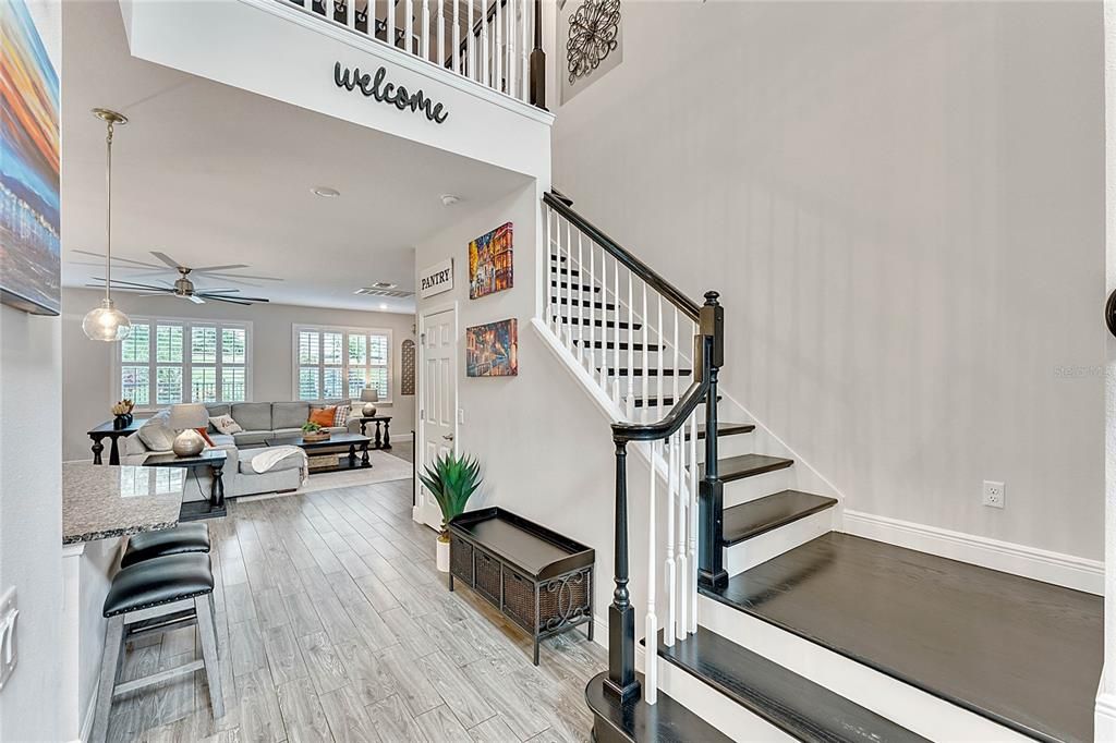 View to Main Living Area and Second Floor Stair, Wood Look Tile