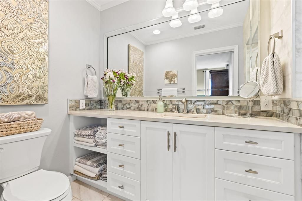 Master bath with quartz counter tops, ample storage and lots of light!