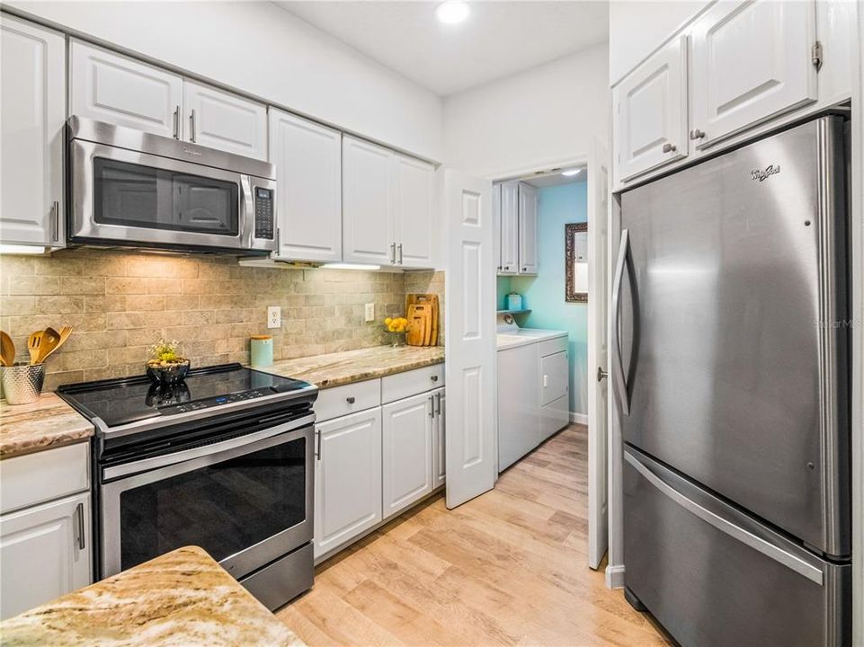 Kitchen has all stainless steel appliances with built in refrigerator. Laundry room attached to the kitchen.