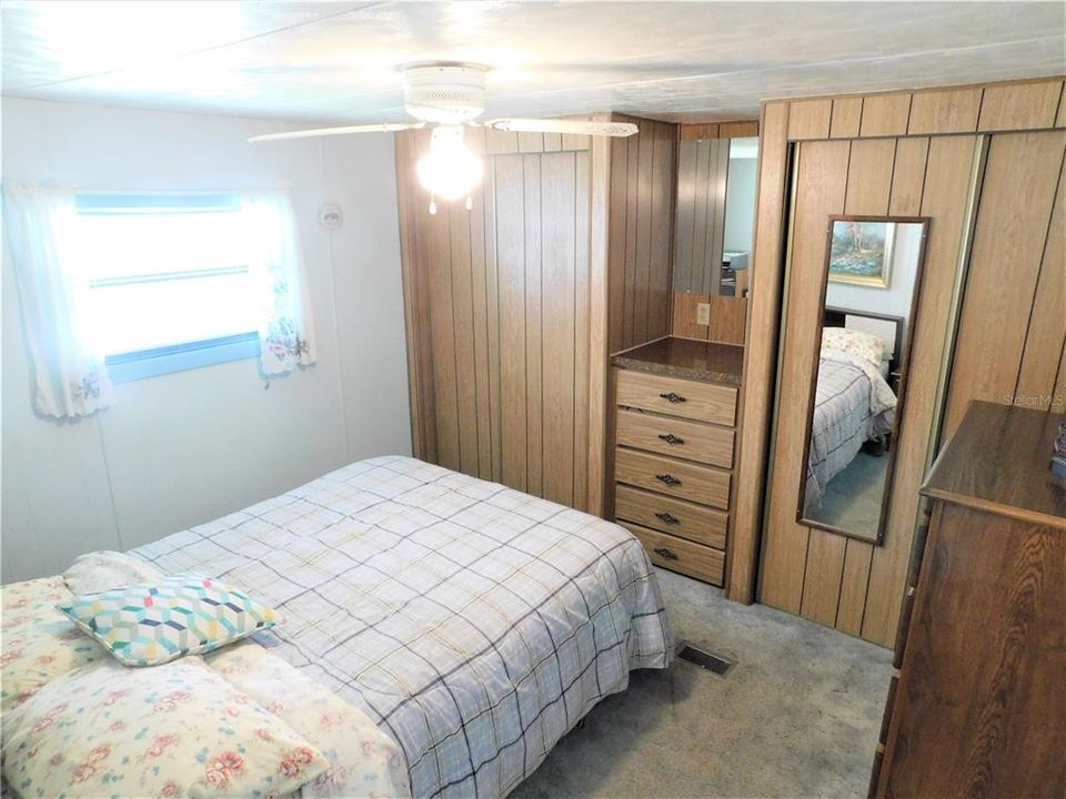 Guest bedroom with 2 closets and built in dresser