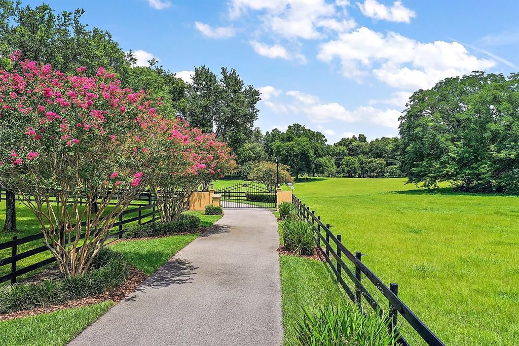 Welcome Home to This Peaceful, Gated Country Estate on 10 Acres.