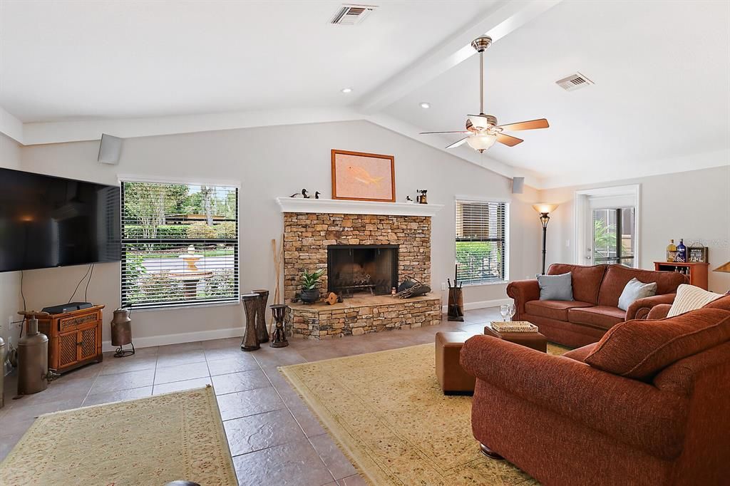 Family Room with Stone  Wood-Burning Fireplace