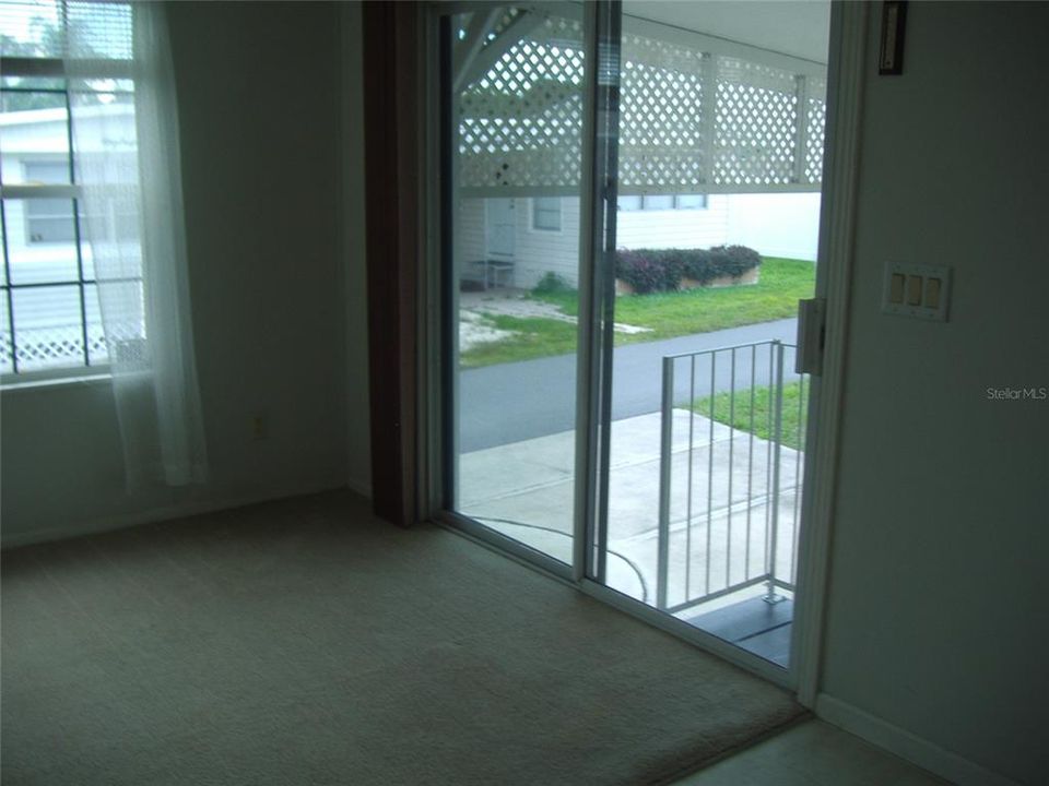 This shows the stairs with entry to the living room through the glass doors.  There is also a separate door entry