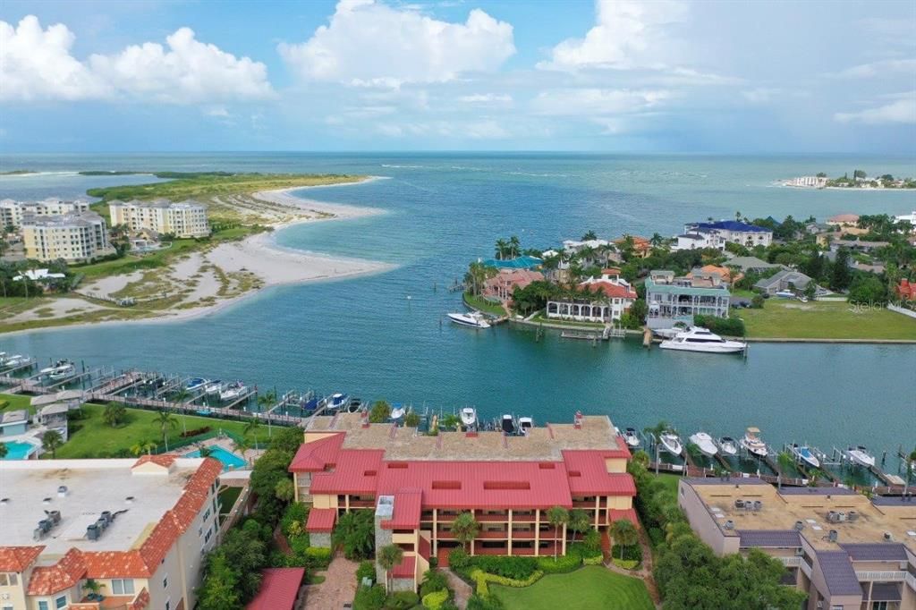 Aerial view of condo community and Grand Canal, Pass a Grille Pass and the Gulf of Mexico