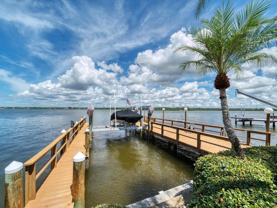 A boater's paradise!Composite decking, 2 lifts with supplemental davit for smaller vessel such as a jet ski- your own Marina!