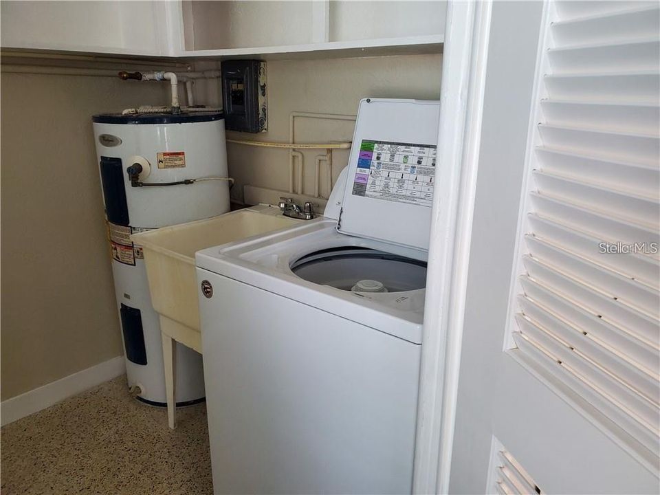 Unit #1 laundry. Full size dryer also just not pictured.