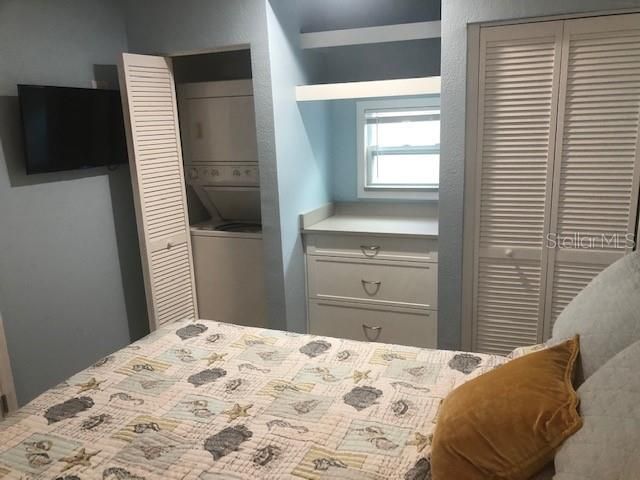 unit #3 bedroom showing laundry closet