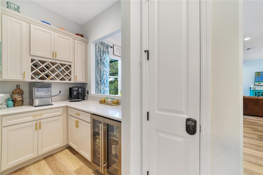 Dry bar area with bar fridge off eating space and kitchen