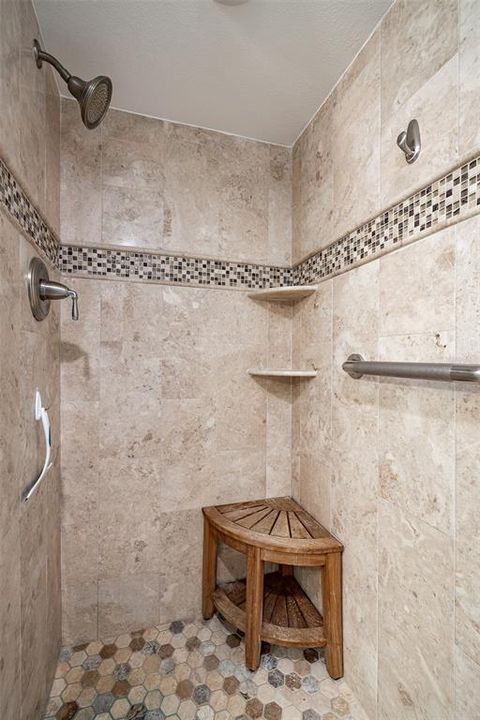 Contrasting tiles accent the shower in the 3rd bathroom