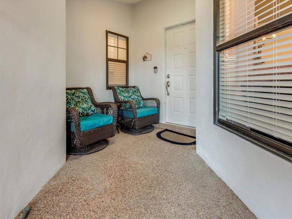 Covered, screened entryway with skylight.