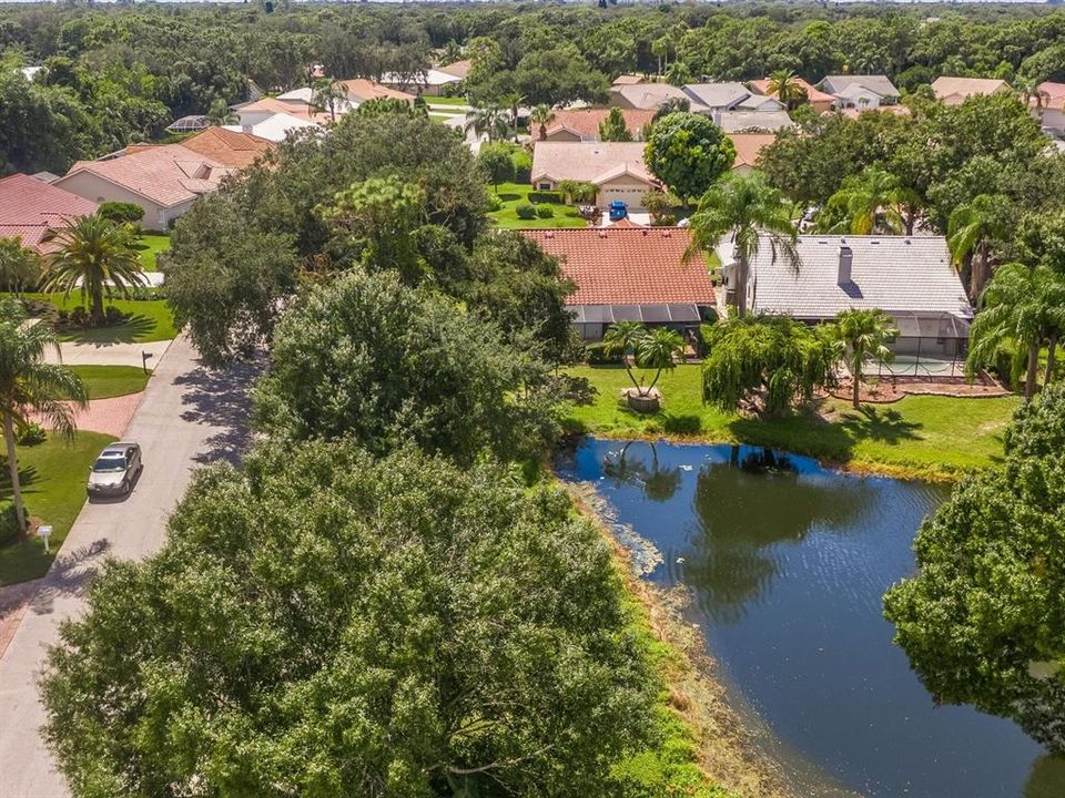 Drone view of home on pond.