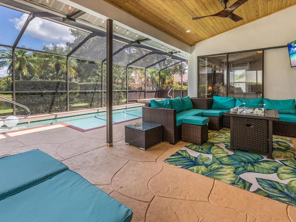 Caged lanai with heated pool and spa.
